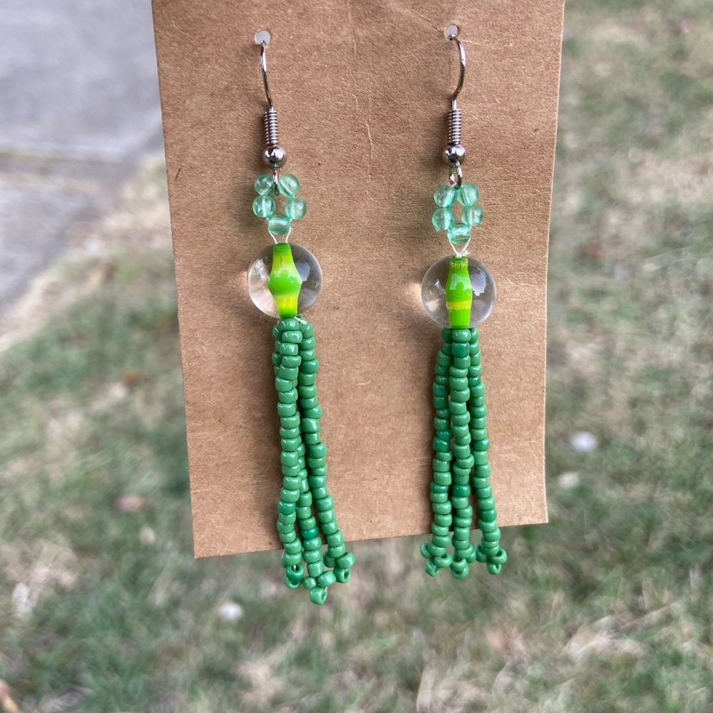 Green earrings in thread